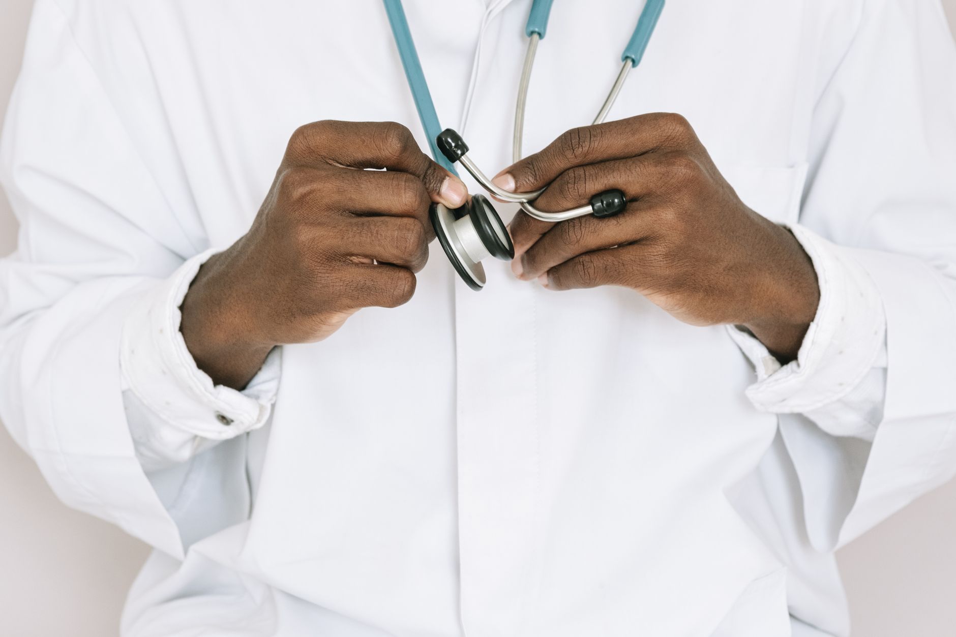 A professional doctor holding a stethoscope, focusing on hands and medical tools. — Navigating Alcohol Detox CentersNear Me: