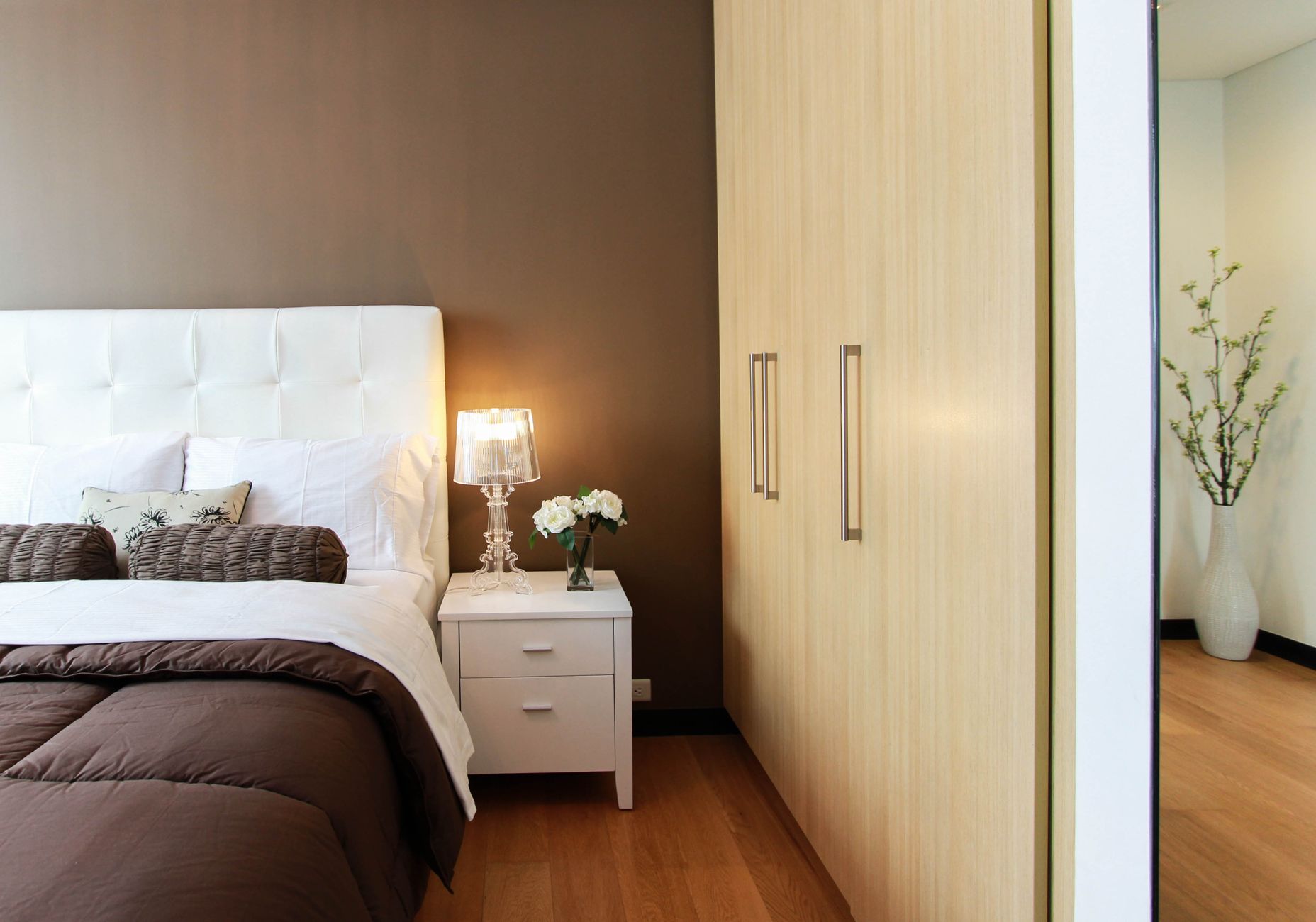 Elegant bedroom with modern furniture, soft lighting, and cozy ambiance. — What to Ask a Bespoke Bed Maker